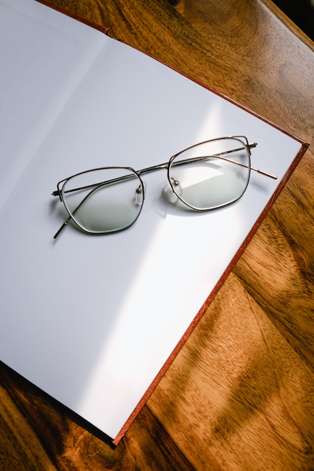 Glasses on white notebook
